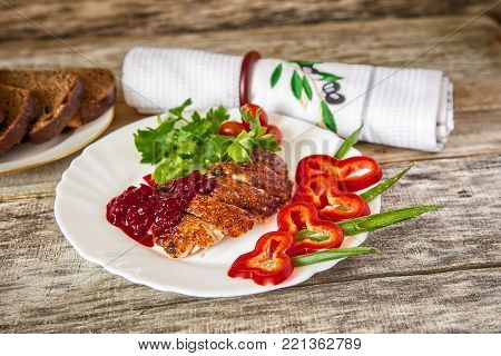 Duck breast slices with vegetabes and greens