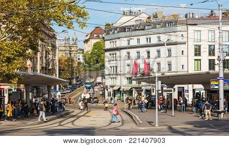 Zurich, Switzerland - 29 September, 2017: tram stops, people and buildings on Bellevueplatz square. Bellevueplatz is a town square in Zurich, named after the former Grandhotel Bellevue on its north side.
