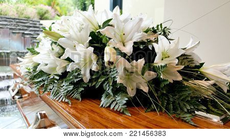 closeup shot of a colorful casket in a hearse or chapel before funeral or burial at cemetery
