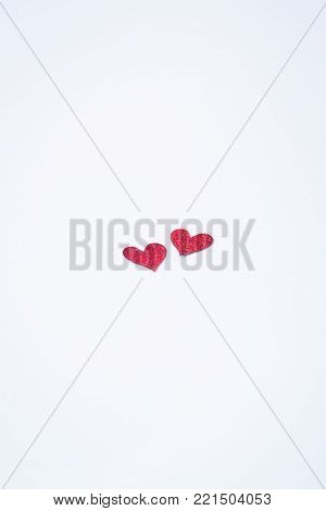 Small handmade red hearts. Isolated. Valentine's or Wedding's day postcard concept. Toned