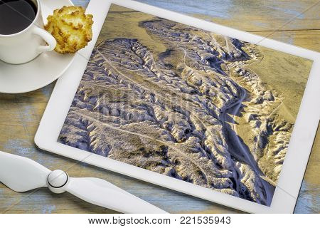 Main Draw OHV Area in Pawnee National Grasslland in northern Colorado, fall or winter scenery, reviewing an aerial image on a digital tablet