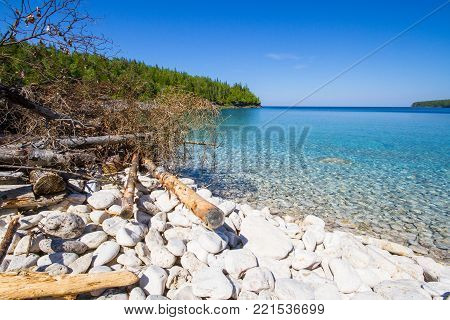 Crystal water and  white stony coastline   at Bruce Peninsula National Park Ontario Canada