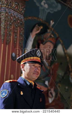 THIMPHU, BHUTAN - DEC 3, 2017: Royal honour guard on duty in front of the Tashichho Dzong, Thimphu, Bhutan. This is Buddhist Monastery and Fortress where the civil government office located.