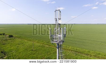 Cellular tower. Equipment for relaying cellular and mobile signal. Fly around up and down.