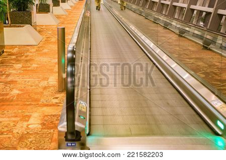 Close up empty travelator or moving walkway in modern airport