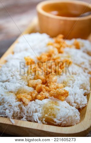 Rice Cake With Coconut Syrup And Rice Cracker.