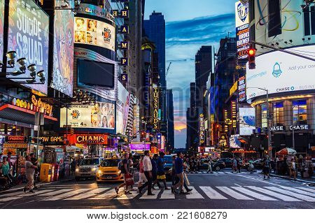 July 2016 People Are Crossing The Street Times Square During Sunset, Manhattan, New York United Stat