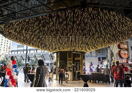 DOWNTOWN LAS VEGAS, LAS VEGAS, NEVADA, USA- NOVEMBER 11, 2017: People at a party outside Oscar's Steakhouse Las Vegas at Downtown Las Vegas, across from the Freemont Street Experience