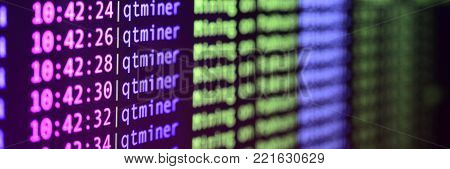 Macro snapshot of the program interface for crypto currency mining on the monitor of an office computer. The concept of mining bitcoins. The flow of information strings and data