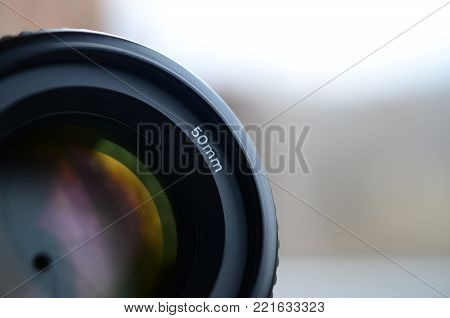 Fragment of a portrait lens for a modern SLR camera. A photograph of a wide-aperture lens with a focal length of 50mm