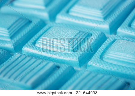 Soles of blue sports shoes. Macro shot