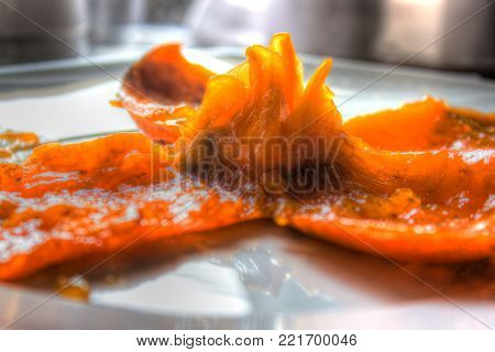 Macro of a persimmon peel on a dish