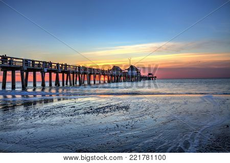 Naples Pier On The Beach At Sunset