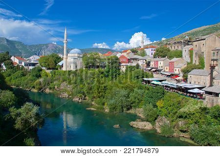 Mostar, Bosnia & Herzegovina - October 2017: Tourists crowded Mostar along Neretva River in Bosnia & Herzegovina