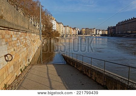 LYON, FRANCE, January 13, 2018 : Floods of the saone river in city center. Saone is open to navigation throughout the year except when it is in flood.