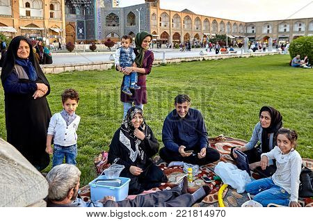 Isfahan, Iran - April 23, 2017: Iranian family make picnicking in the Naghshe Jahan square.