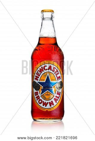 LONDON, UK - JANUARY 10, 2018: Bottle of Newcastle Brown craft ale beer on white background with dew and reflection.