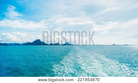 Water trail foaming behind a ferry boat in Aegean sea, Greece, Europe, Boat wake in the sea, on a brilliant sunny day.This is the view behind a ship ferry.