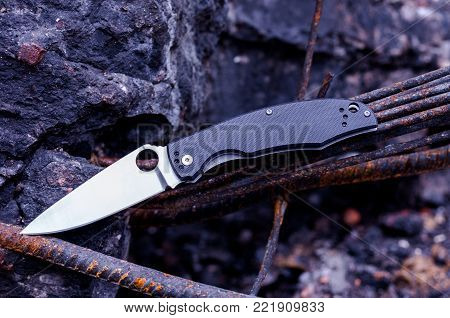 The knife of the rescuer. The knife of rescue work. Pocket knife.