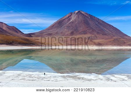 The natural colors of the green lagoon in the Siloli desert near the border of Chile and the Uyuni Salt Flat in Bolivia