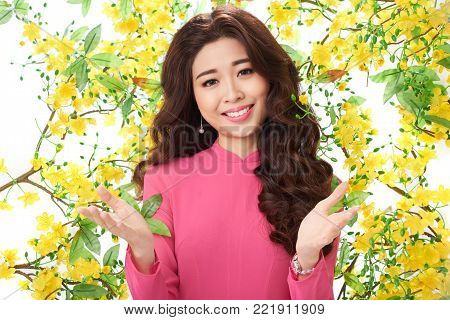 Portrait of happy Vietnamese young woman celebraring Tet