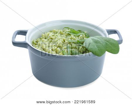 Dish with tasty spinach risotto on white background