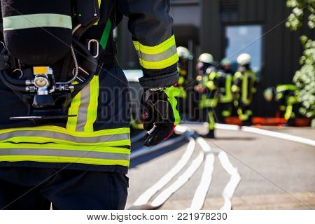 german fireman ( Feuerwehr ) stands near an accident