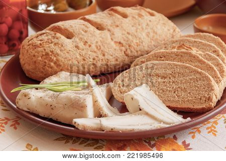 salted pork fat and bread cut into pieces