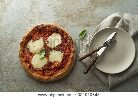 Pizza Margherita Served With Mozzarella Cheese, Tomato Sauce And Fresh Basil