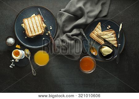 Breakfast Served With Orange Juice, Toast Sendwich, Boiled Egg, Jam And Butter. Delicious Healthy Br