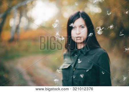 Dreamy Beautiful Girl In Airy White Fluff On Bokeh Background With Yellow Leaves. Inspired Girl In A