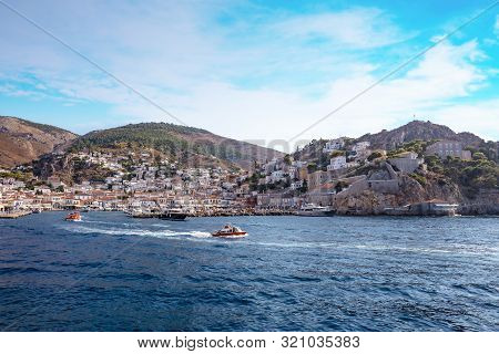 Picturesque View At The Port With Water Taxi Town Of Hydra Island In Greece
