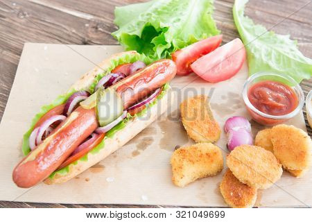 Delicious Fast Food. Hot Dog With Grilled Sausages, Onions And Vegetables.