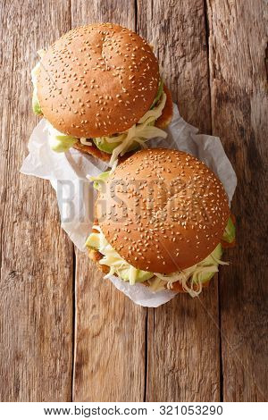 Traditional Mexican Cemita Poblana Sandwich With Meat, Cheese, Avocado And Sauce Close-up. Vertical