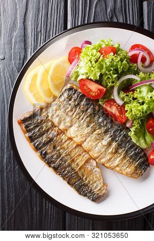 Grilled Mackerel Fillet With A Side Dish Of Fresh Vegetable Salad Close-up On A Plate.vertical Top V