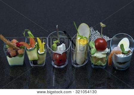 Mini Canapes For Refreshments At Banquets Receptions Catering On A Dark Background.