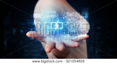 Elegant hand holding battery with full of energy