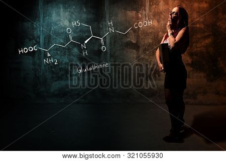 Sexy Girl Or Secretary Or Female Student Presenting Handdrawn Chemical Formula Of Glutathione Antiox