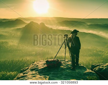 Girl Frind Photographer Artist Working On The Edge. View Point On High Mountain Peak With Circle Vie