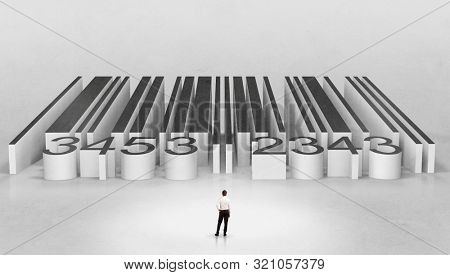 Young businessman standing in front of a big codebar