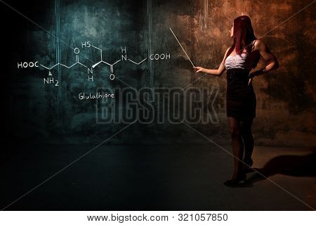 Sexy Girl Or Secretary Or Female Student Presenting Handdrawn Chemical Formula Of Glutathione Antiox