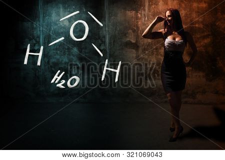 Sexy Girl Or Secretary Or Female Student Presenting Handdrawn Chemical Formula Of H2O Water