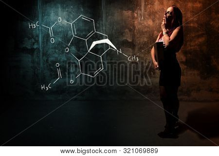 Sexy Girl Or Secretary Or Female Student Presenting Handdrawn Chemical Formula Of Heroin