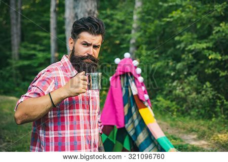 Love Makes A Cottage A Castle. Homemade Tent - Hut. Camping. Homemade Tent Camping For Free Man. Han