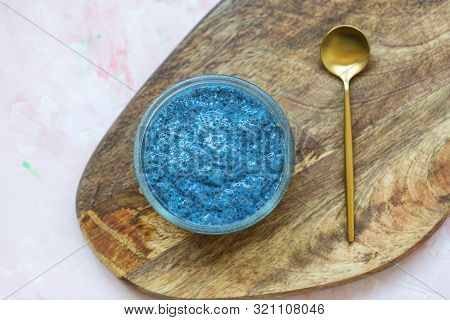 Blue Spirulina Or Butterfly Pea Flower Blue Matcha Powder Chia Seed Pudding Bowl And Golden Spoon. C