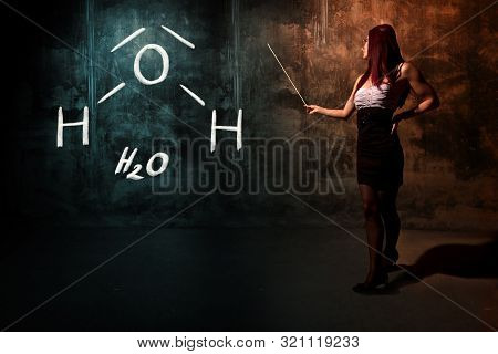 Sexy Girl Or Secretary Or Female Student Presenting Handdrawn Chemical Formula Of H2O Water