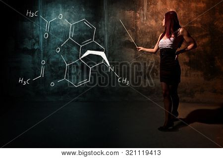 Sexy Girl Or Secretary Or Female Student Presenting Handdrawn Chemical Formula Of Heroin