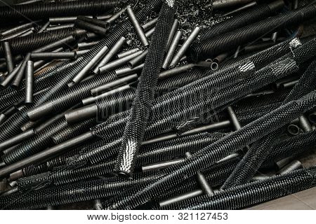 Steel Pipes With Spiral Fins. Industrial Steel Product Manufacturing.