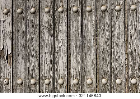 Textured Wooden Panel. Old Door Close-up In A Rural Village House. Wood Texture In Natural Color.