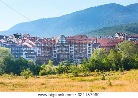 Bansko, Bulgaria - June 13, 2017: St Ivan Rilski And Panorama Hotel Houses And Summer Mountains Pano